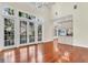 Spacious living room with lots of light, kitchen, and double doors at 87 Dungannon Hall, Kiawah Island, SC 29455