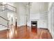 Bright and airy living room with fireplace, built-in shelves, and staircase at 87 Dungannon Hall, Kiawah Island, SC 29455