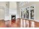 Bright and airy living room with fireplace and wall of windows at 87 Dungannon Hall, Kiawah Island, SC 29455
