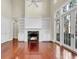 Bright and airy living room with fireplace and double doors at 87 Dungannon Hall, Kiawah Island, SC 29455