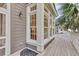 Spacious porch featuring a window nook and a decorative front door mat at 87 Dungannon Hall, Kiawah Island, SC 29455