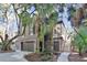 Charming home with a multi-level deck surrounded by lush landscaping and mature trees at 87 Dungannon Hall, Kiawah Island, SC 29455