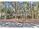 Charming home with a multi-level deck surrounded by lush landscaping and mature trees at 87 Dungannon Hall, Kiawah Island, SC 29455