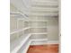 Spacious walk-in closet with custom shelving and storage, providing ample room for organization at 87 Dungannon Hall, Kiawah Island, SC 29455