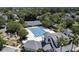 Aerial view of a luxurious pool, playground, and tennis courts surrounded by lush trees and charming homes at 914 Tupelo Bay Dr, Mount Pleasant, SC 29464