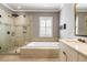 Serene bathroom featuring a separate tub and glass-enclosed shower at 914 Tupelo Bay Dr, Mount Pleasant, SC 29464