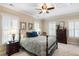Cozy bedroom with a large bed, side tables, and natural lighting from windows at 914 Tupelo Bay Dr, Mount Pleasant, SC 29464