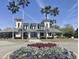 Lovely community clubhouse with towers, beachy vibes, lots of palm trees, and well maintained landscaping at 914 Tupelo Bay Dr, Mount Pleasant, SC 29464