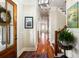 Elegant entryway with wood floors, staircase, decorative rug, and views into other rooms at 914 Tupelo Bay Dr, Mount Pleasant, SC 29464