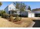 Charming blue two-story home featuring a two-car garage and well-manicured front yard at 914 Tupelo Bay Dr, Mount Pleasant, SC 29464