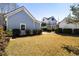 Side view of a light blue home with trimmed hedges and a well-manicured lawn at 914 Tupelo Bay Dr, Mount Pleasant, SC 29464