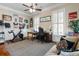 Bright home office featuring hardwood floors, large windows and a ceiling fan at 914 Tupelo Bay Dr, Mount Pleasant, SC 29464
