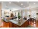 Open kitchen with a granite island, hardwood floors, stainless steel appliances and a breakfast nook at 914 Tupelo Bay Dr, Mount Pleasant, SC 29464