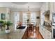 Kitchen with stainless steel appliances, granite counters, hardwood floors, an island and breakfast table at 914 Tupelo Bay Dr, Mount Pleasant, SC 29464