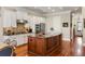 Spacious kitchen featuring stainless steel appliances, an island, granite counters and hardwood floors at 914 Tupelo Bay Dr, Mount Pleasant, SC 29464
