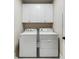 Laundry room featuring a side-by-side washer and dryer beneath white cabinets at 914 Tupelo Bay Dr, Mount Pleasant, SC 29464
