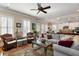 Bright and airy living room with hardwood floors, ceiling fan, and abundant natural light at 914 Tupelo Bay Dr, Mount Pleasant, SC 29464