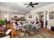 Spacious living room with open layout, hardwood floors, and views to the kitchen and dining area at 914 Tupelo Bay Dr, Mount Pleasant, SC 29464