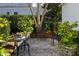 Secluded backyard patio featuring decorative gravel, shrubs, and outdoor seating at 914 Tupelo Bay Dr, Mount Pleasant, SC 29464