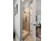 Modern bathroom featuring walk-in shower with glass door and tan tile at 914 Tupelo Bay Dr, Mount Pleasant, SC 29464