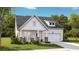 Charming two-story home with stone accents, covered porch and attached garage at 1012 Swamp Rose Run, Summerville, SC 29485