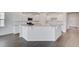 Bright kitchen with white cabinets, granite countertops, and modern stainless steel appliances at 1012 Swamp Rose Run, Summerville, SC 29485