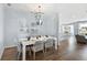 Bright dining room with modern chandelier, stylish table setting, and an open concept design at 1014 Swamp Rose Run, Summerville, SC 29485
