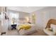 Charming bedroom with white iron bed frame, bright, natural light and stylish furnishings create a cozy and inviting space at 1016 Swamp Rose Run, Summerville, SC 29485