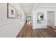 Bright entryway features wood flooring, white shiplap walls, recessed lighting, and decorative mirror, creating a welcoming ambiance at 1016 Swamp Rose Run, Summerville, SC 29485