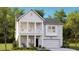 Charming two-story home with covered front porch and balcony, complemented by lush landscaping and a two-car garage at 1016 Swamp Rose Run, Summerville, SC 29485