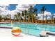 Community pool with beach balls, lounge chairs, and a clear blue sky at 1016 Swamp Rose Run, Summerville, SC 29485
