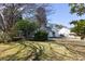 View of the home's backyard with established trees and partial shade coverage at 1051 Wayfarer Ln, Charleston, SC 29412