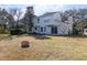 The home's backyard has a large grassy area and mature trees on the perimeter at 1051 Wayfarer Ln, Charleston, SC 29412