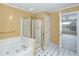 Bathroom features a large soaking tub and a stand-up shower with gold trim at 1051 Wayfarer Ln, Charleston, SC 29412