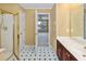 Bathroom with a marble-topped vanity and a stand-up shower with gold trim at 1051 Wayfarer Ln, Charleston, SC 29412
