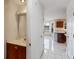 Bathroom with vanity, tile floors, and white door at 1051 Wayfarer Ln, Charleston, SC 29412