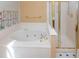 Bathroom features a large soaking tub and a stand-up shower with gold trim at 1051 Wayfarer Ln, Charleston, SC 29412