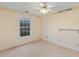 Bedroom featuring neutral carpet, a ceiling fan, and a large window at 1051 Wayfarer Ln, Charleston, SC 29412