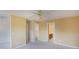 Spacious bedroom featuring neutral carpet, ensuite, and a ceiling fan at 1051 Wayfarer Ln, Charleston, SC 29412