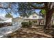 Charming two-story home with light yellow siding and a classic colonial design at 1051 Wayfarer Ln, Charleston, SC 29412