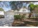 Charming two-story home features a spacious two-car garage and inviting front porch at 1051 Wayfarer Ln, Charleston, SC 29412