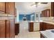 Open kitchen with tiled floor, granite countertops, and view into the living room at 1051 Wayfarer Ln, Charleston, SC 29412