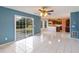 Eat-in kitchen with tile floors, ceiling fan, and access to outdoor deck at 1051 Wayfarer Ln, Charleston, SC 29412