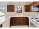 Kitchen area featuring ample counter space, wood cabinets, and white appliances at 1051 Wayfarer Ln, Charleston, SC 29412