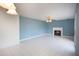Open living room with tile floors, ceiling fan, and fireplace at 1051 Wayfarer Ln, Charleston, SC 29412