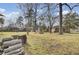 Large backyard with a wooded view features a play structure and room for outdoor enjoyment at 108 Gambels Ln, Summerville, SC 29485