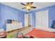 room with blue walls, hardwood floors, ceiling fan, dresser and themed decor at 108 Gambels Ln, Summerville, SC 29485