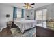 Serene bedroom featuring a ceiling fan, ample natural light, and calming decor at 108 Gambels Ln, Summerville, SC 29485