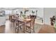 Dining room with classic wooden table and chairs, and ample natural light at 108 Gambels Ln, Summerville, SC 29485
