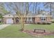 Charming single story brick home with a manicured lawn and attached garage at 108 Gambels Ln, Summerville, SC 29485